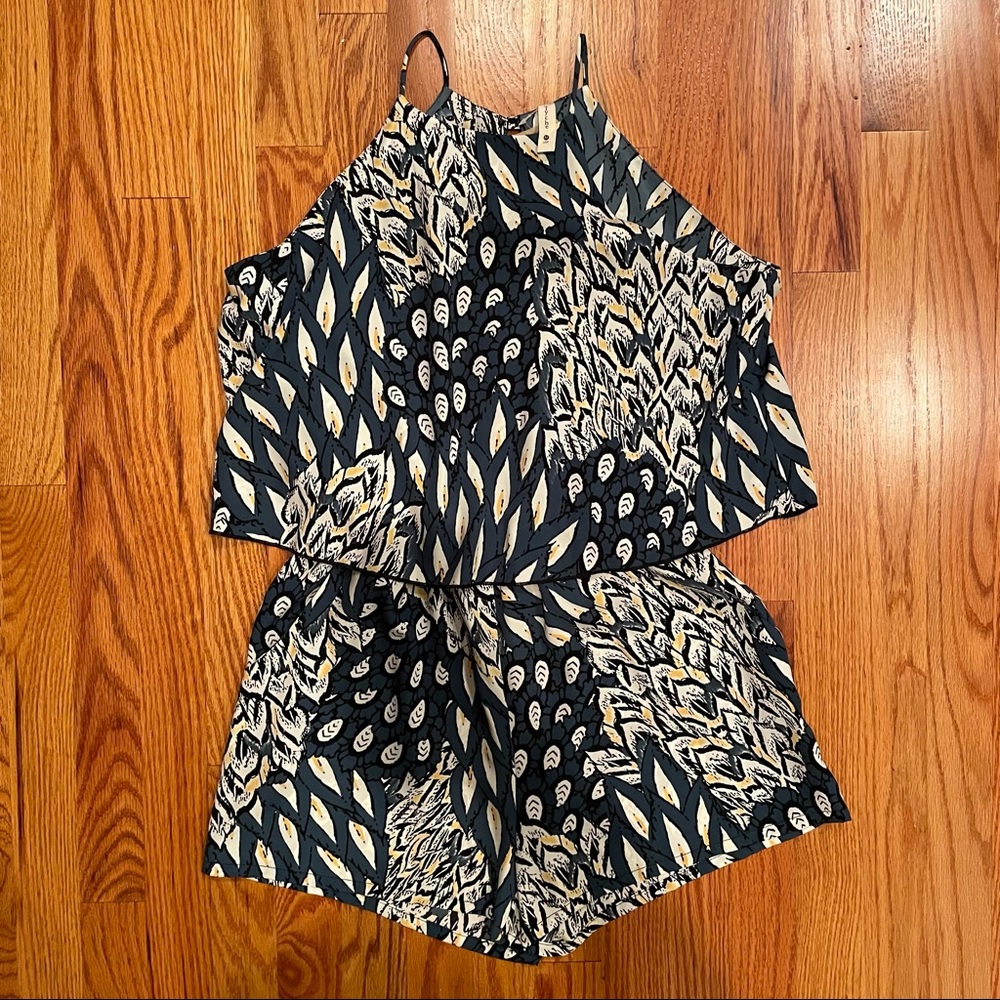 NWT Tyche teal romper with black/white/yellow peacock pattern